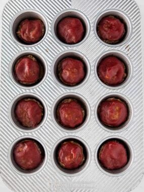 Meatloaf muffins in a tin pan.