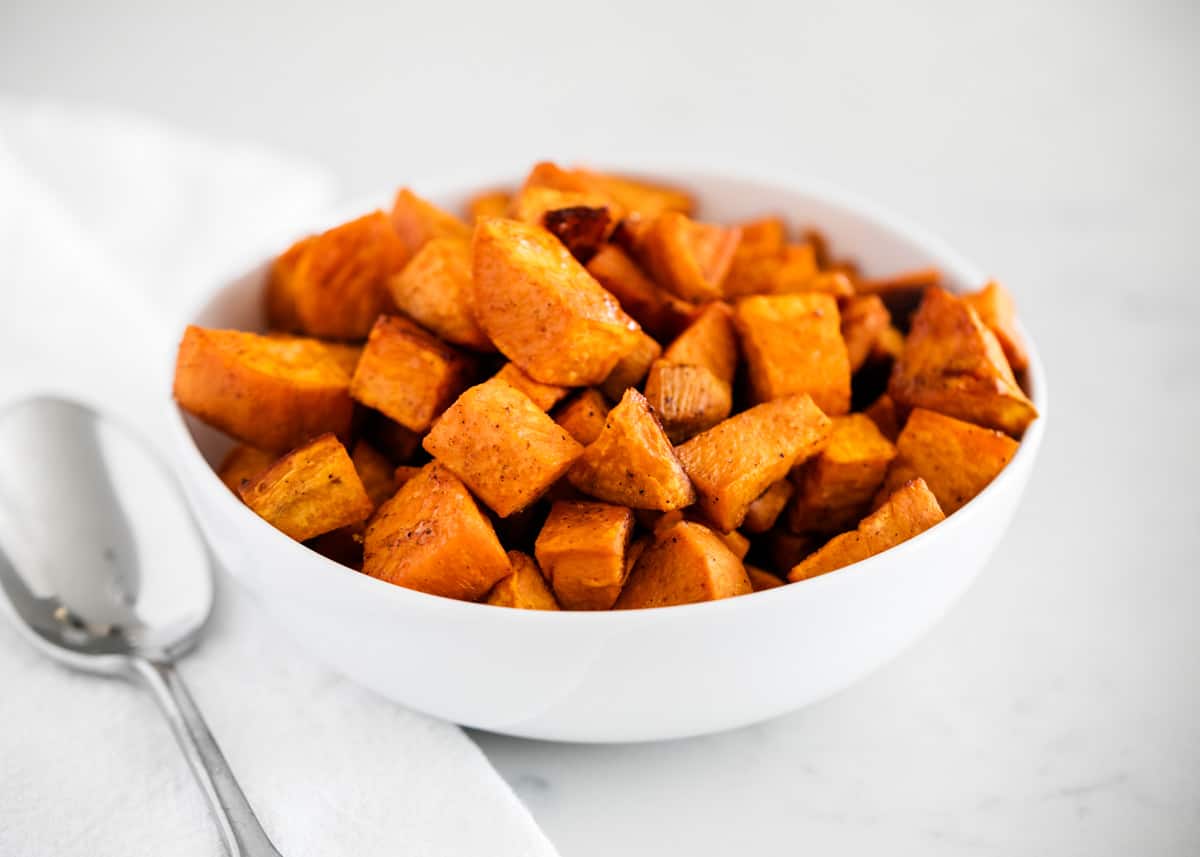 Sweet potatoes in a white bowl. 