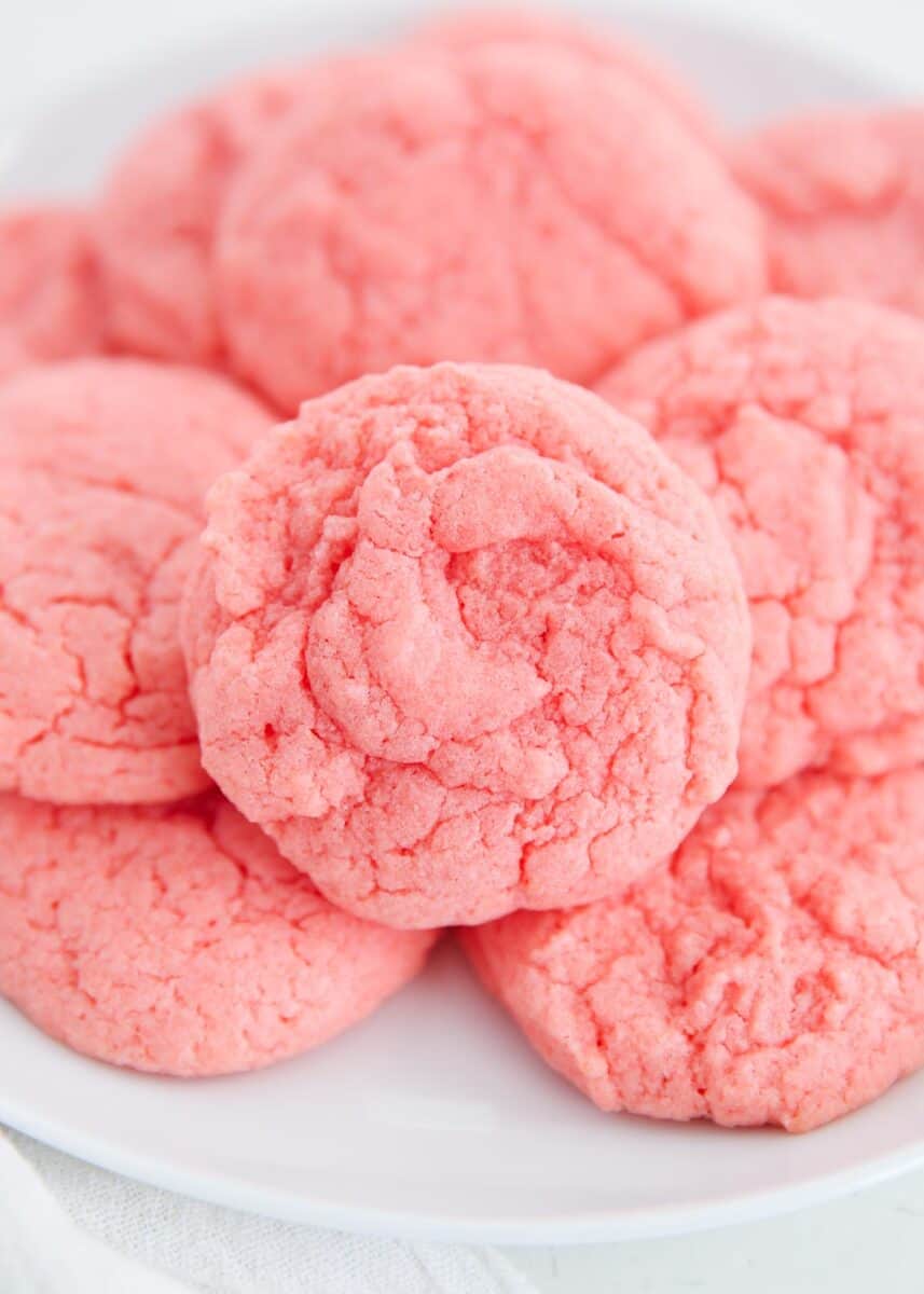 Strawberry cake mix cookies stacked on each other.