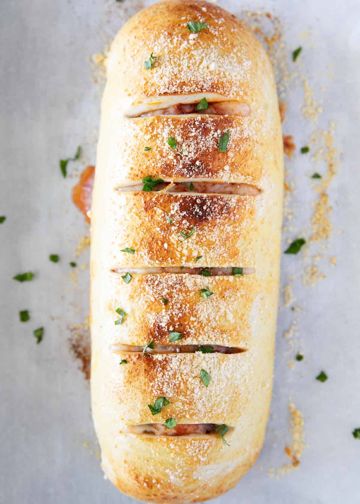 An overhead photo shot of stromboli on a baking sheet. 