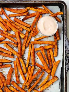 Sweet potato fries on a baking sheet.