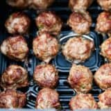 Air fryer meatballs in basket.