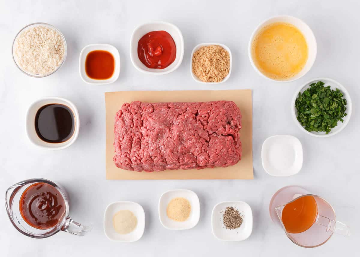 BBQ meatloaf ingredients on a marble counter.