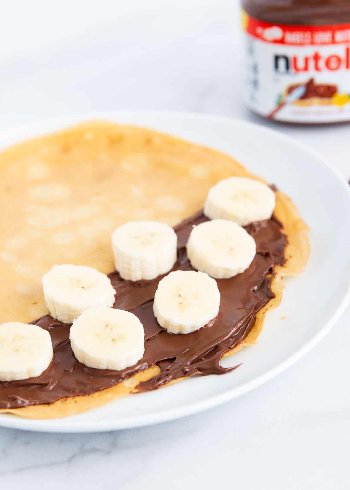 A nutella crepe with bananas on it. 
