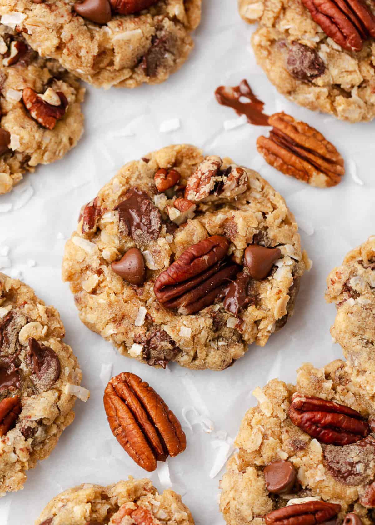 Cowboy cookies and pecans on counter.
