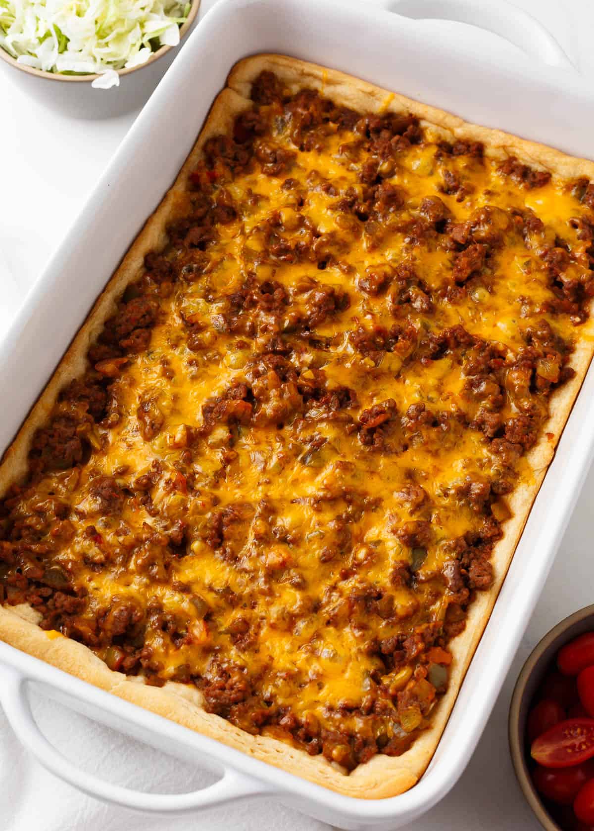 Crescent roll taco bake in a baking dish.