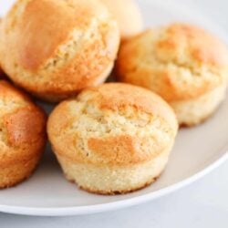 Breakfast muffins on a white plate.