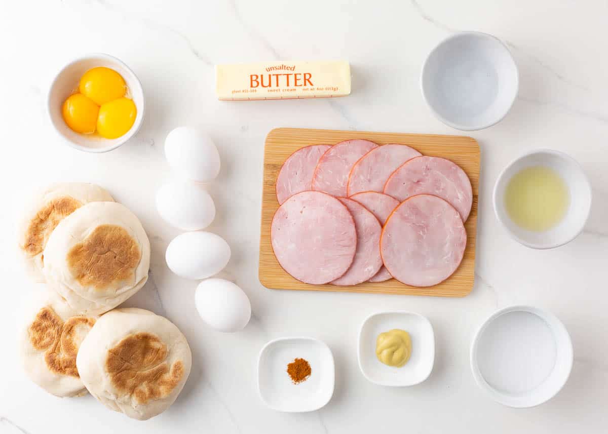 Eggs Benedict ingredients on a counter.