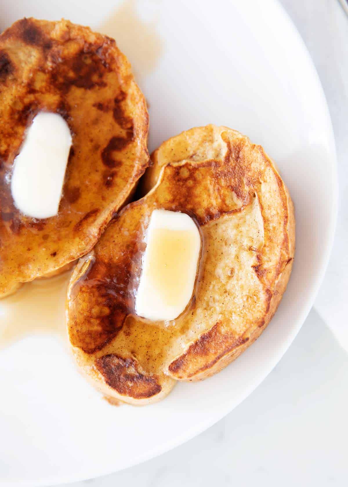 french toast on white plate close up