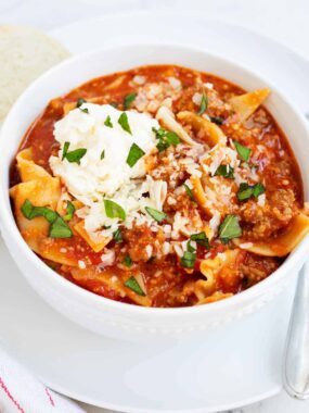 Lasagna soup in a white bowl.