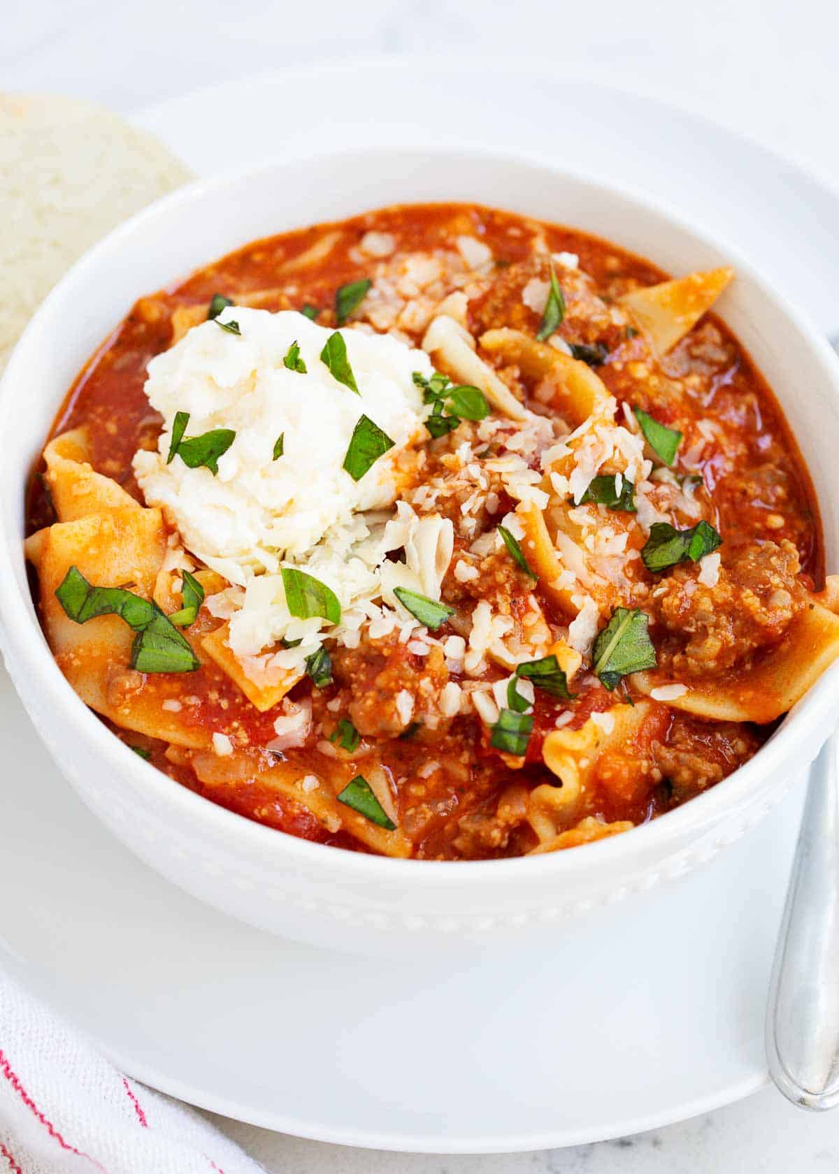 Lasagna soup in a white bowl.