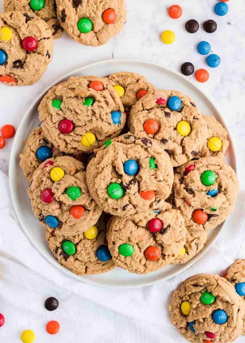 These peanut butter M&M cookies are super soft, thick and bursting with chocolate. They are the perfect cookie recipe for any peanut butter lover! Best peanut butter m&m cookies on a plate.