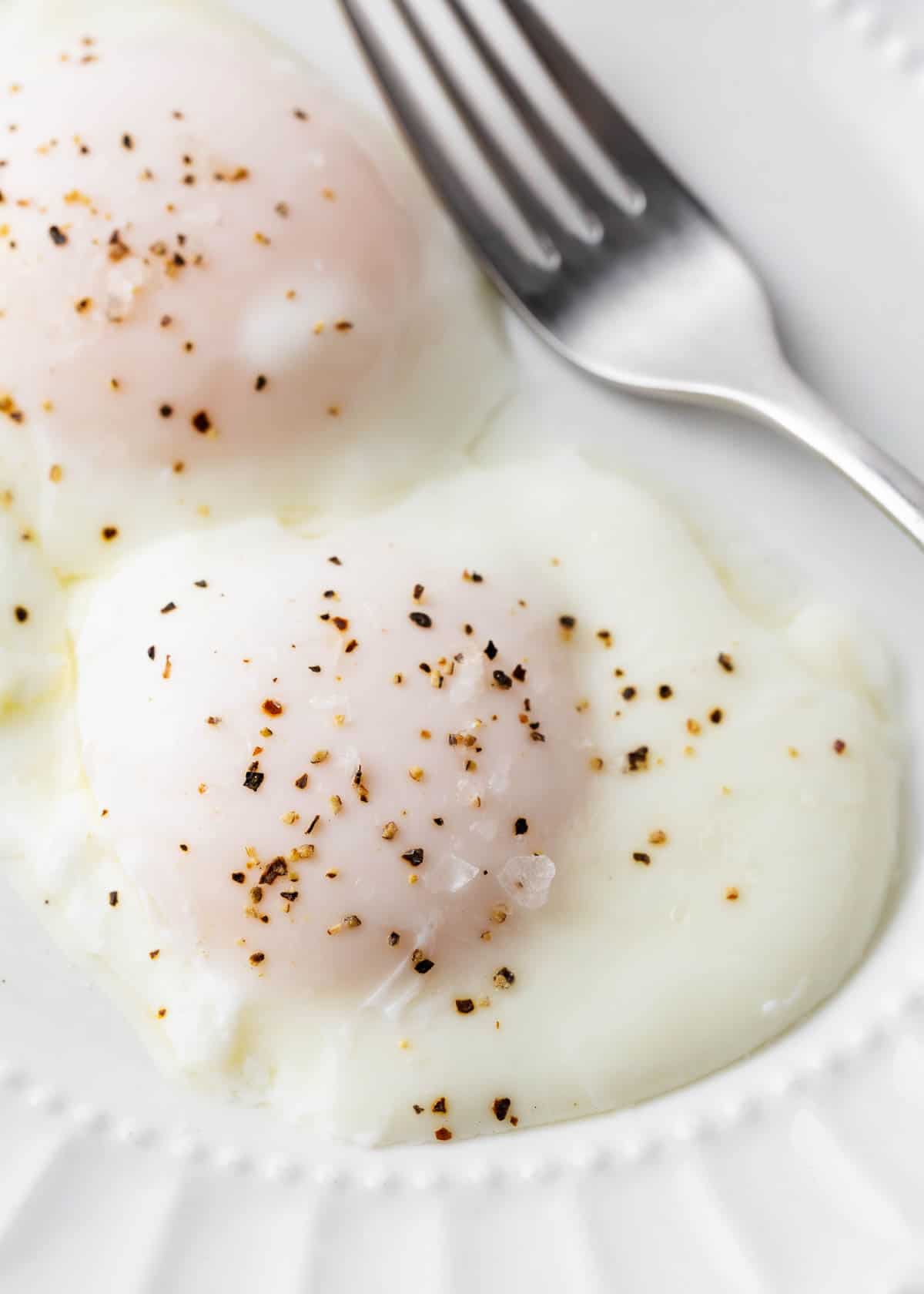 Poached egg on white plate.