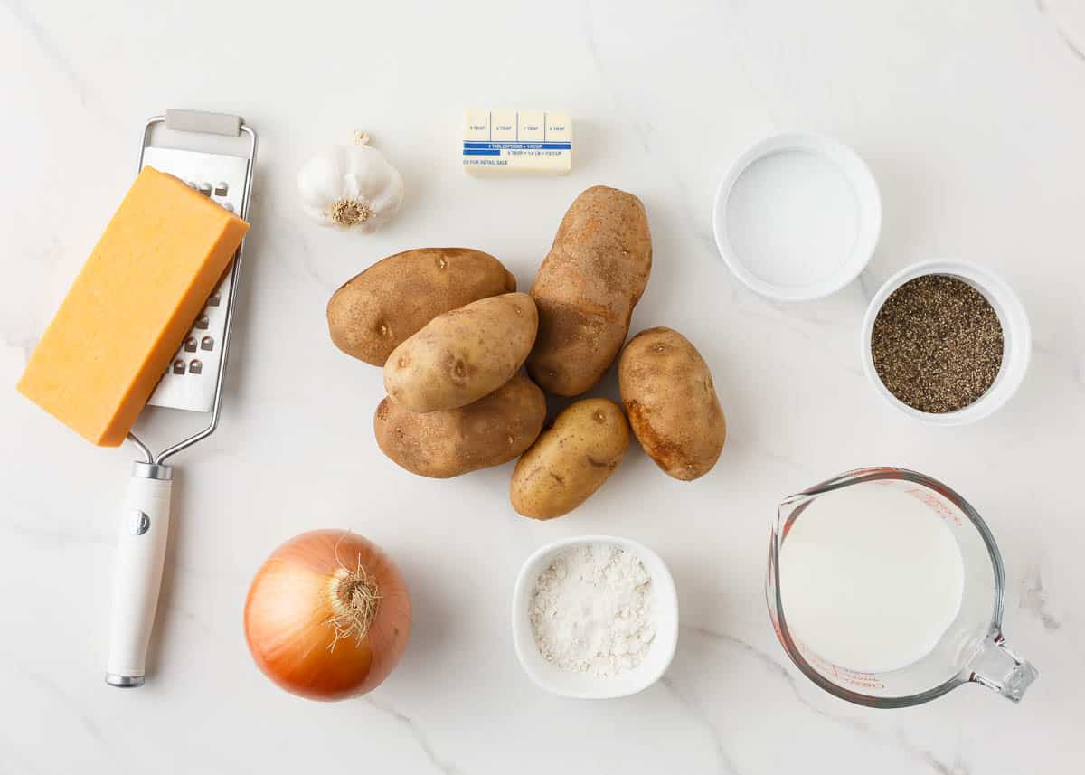 Potatoes au gratin ingredients on counter.