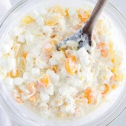 Ambrosia salad in a glass bowl.