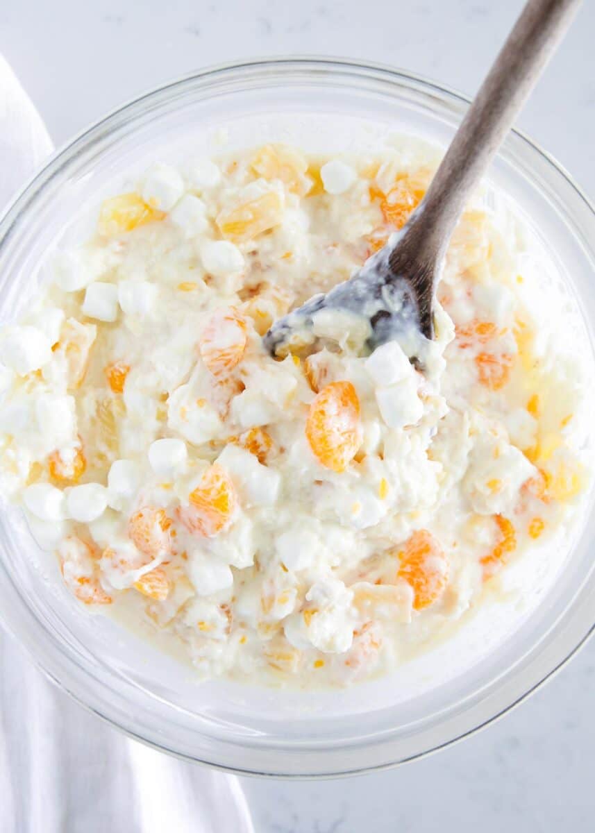 Ambrosia salad in a glass bowl.