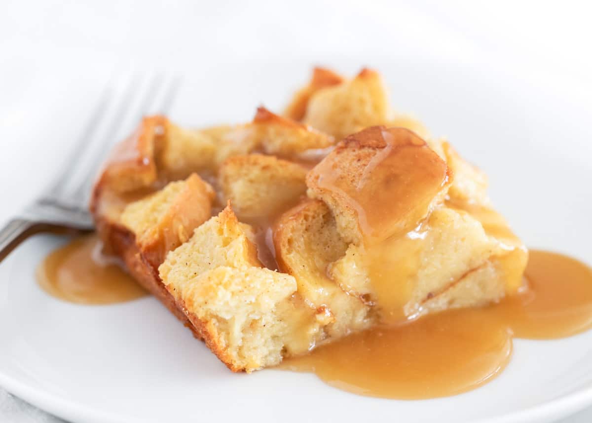 Bread pudding on a white plate.