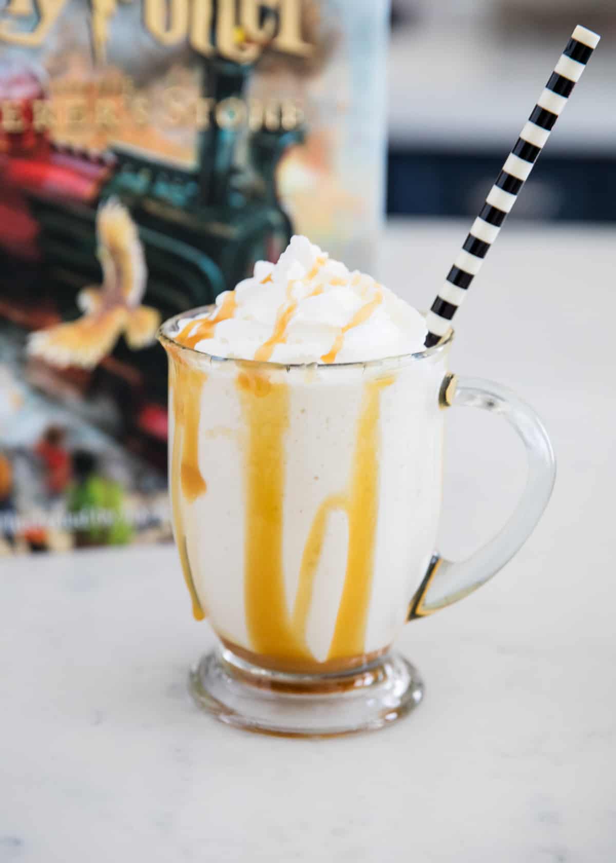 Butterbeer in a glass cup. 