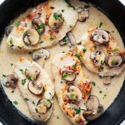 Chicken marsala cooked in an iron skillet.