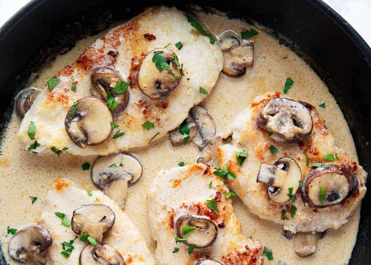 Chicken marsala in iron skillet.