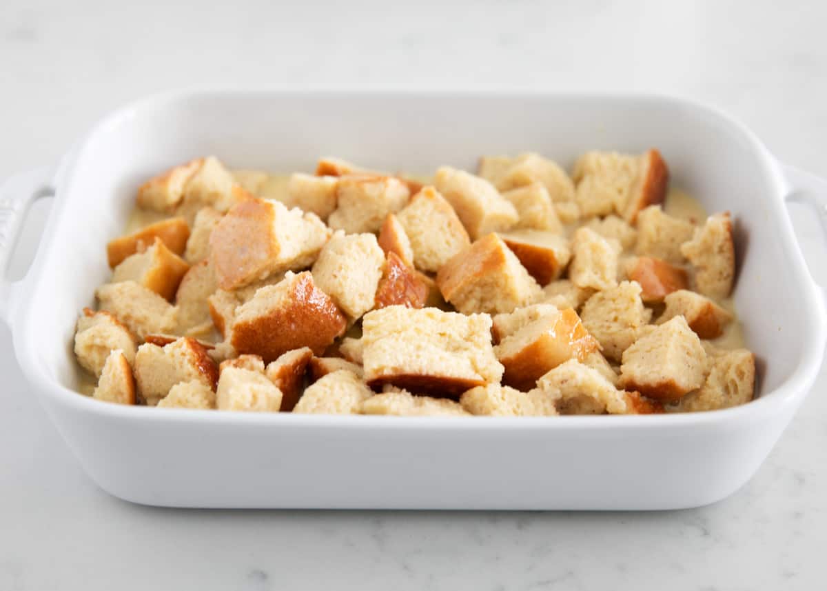 Cubed bread in a white pan.