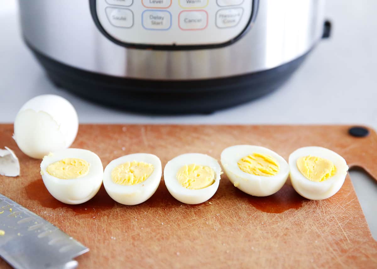 Instant pot boiled eggs on cutting board.