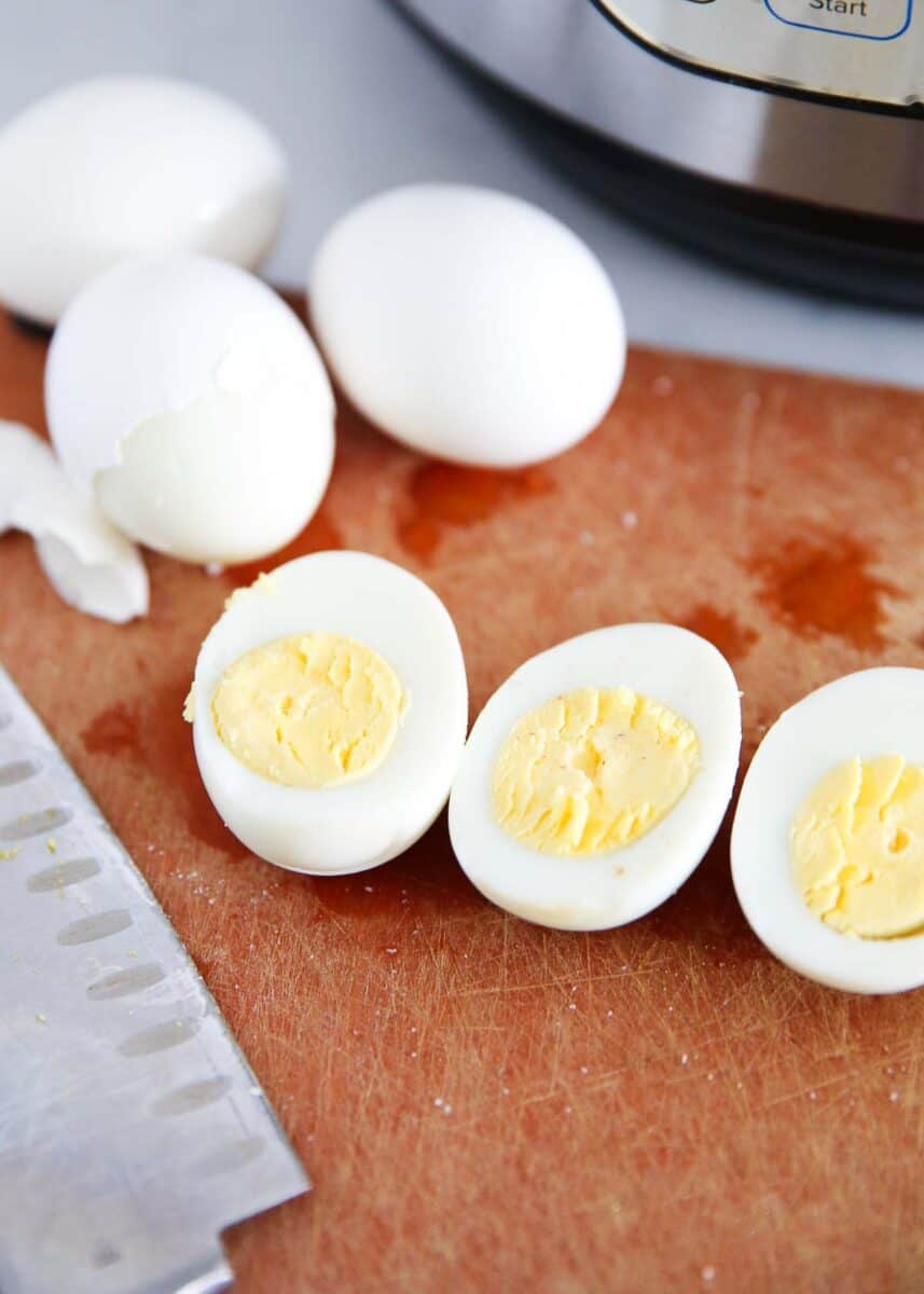 Cut eggs on cutting board.