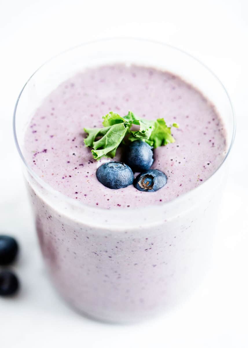 Kale smoothie in a glass cup.