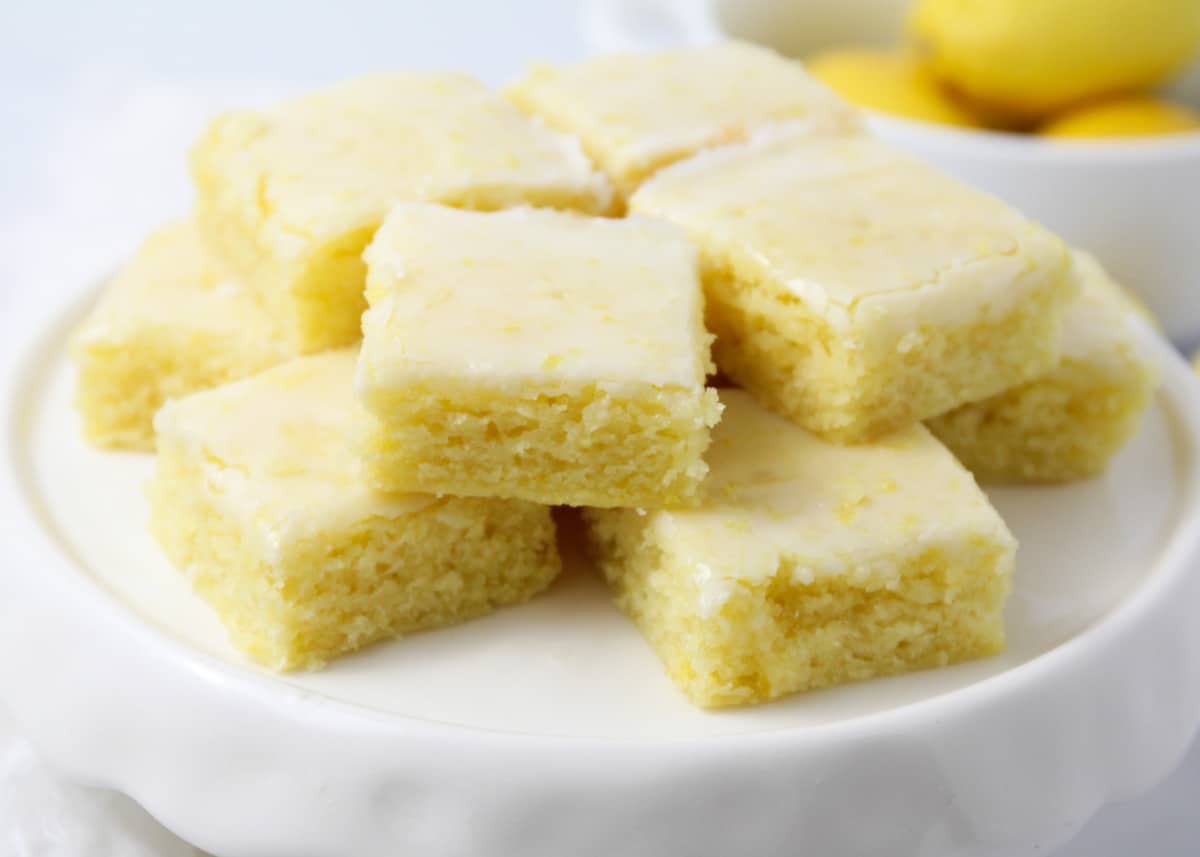 Lemon brownies on a white plate. 