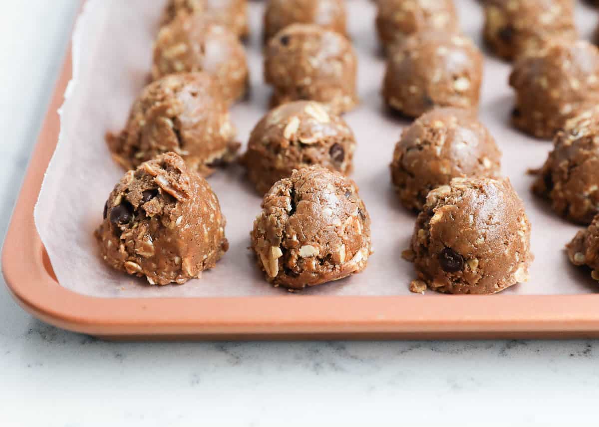 Protein balls on a baking sheet with parchment paper. 