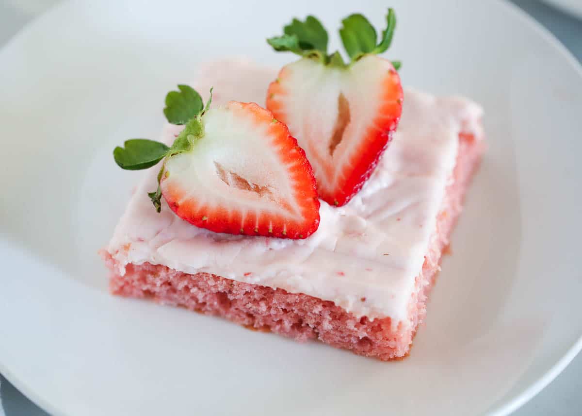 Strawberry brownie on a white plate. 
