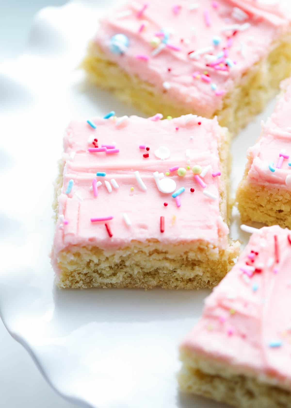 Sugar cookie bars in a white plate. 