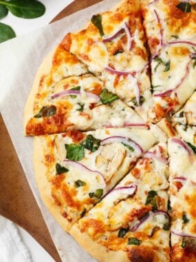 Sliced alfredo pizza.