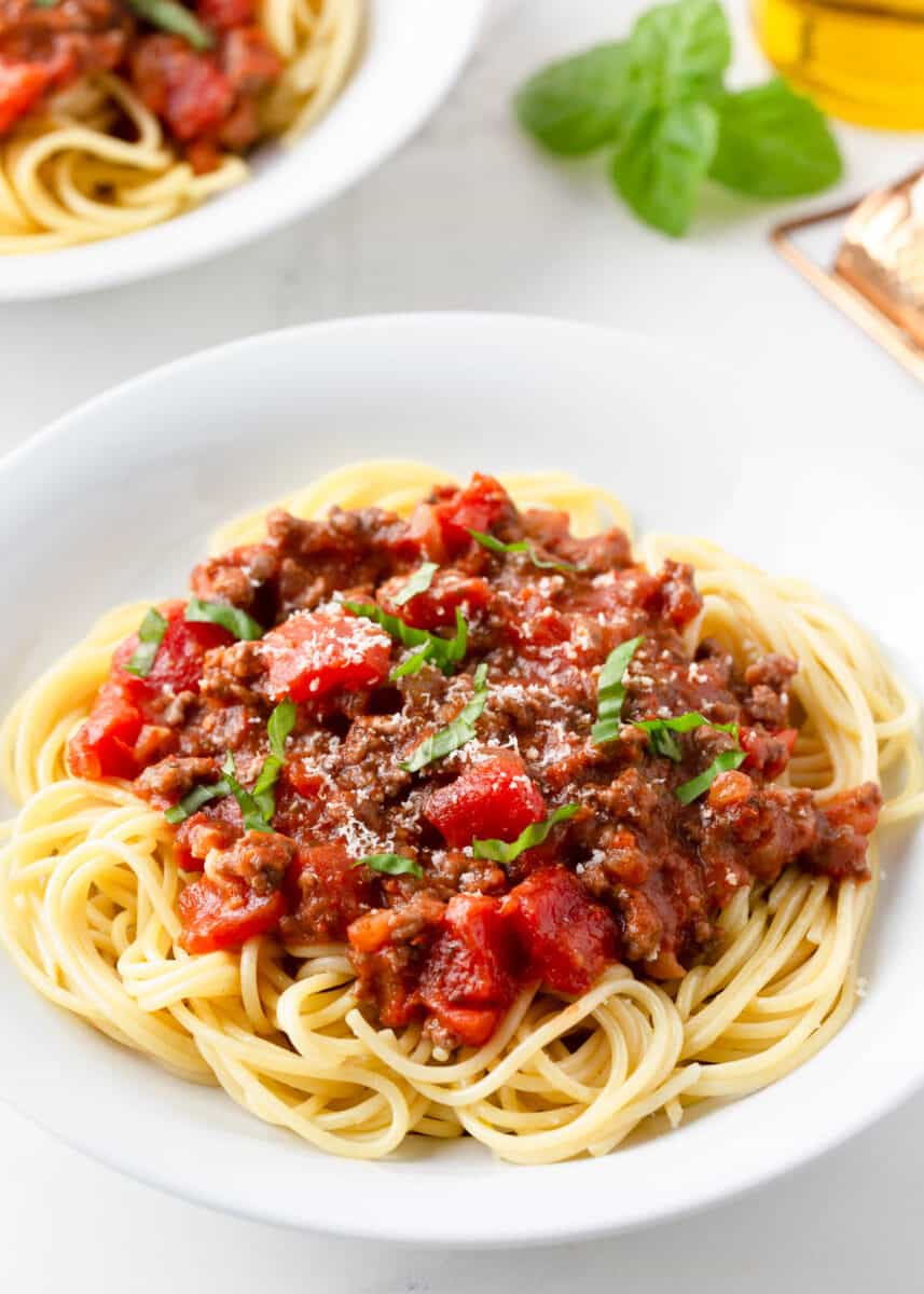 Spaghetti in a white bowl.