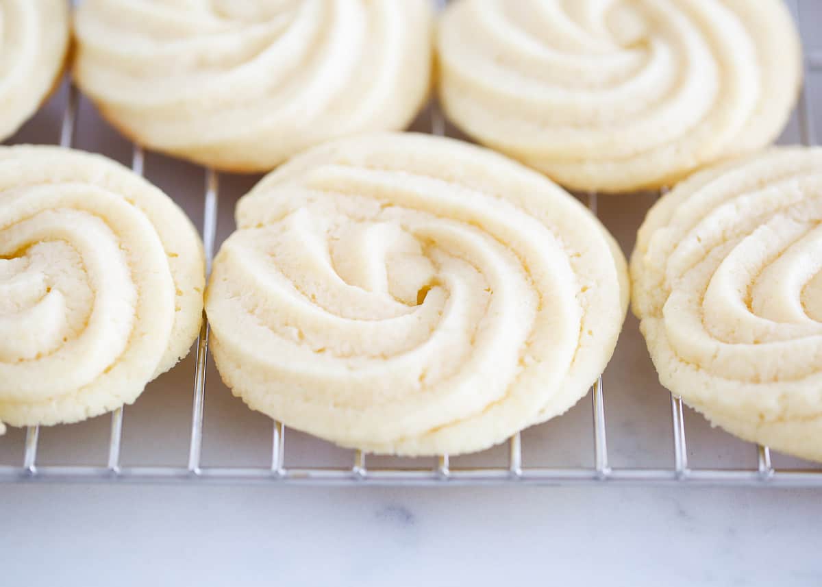 Butter cookies on a cooling rack.