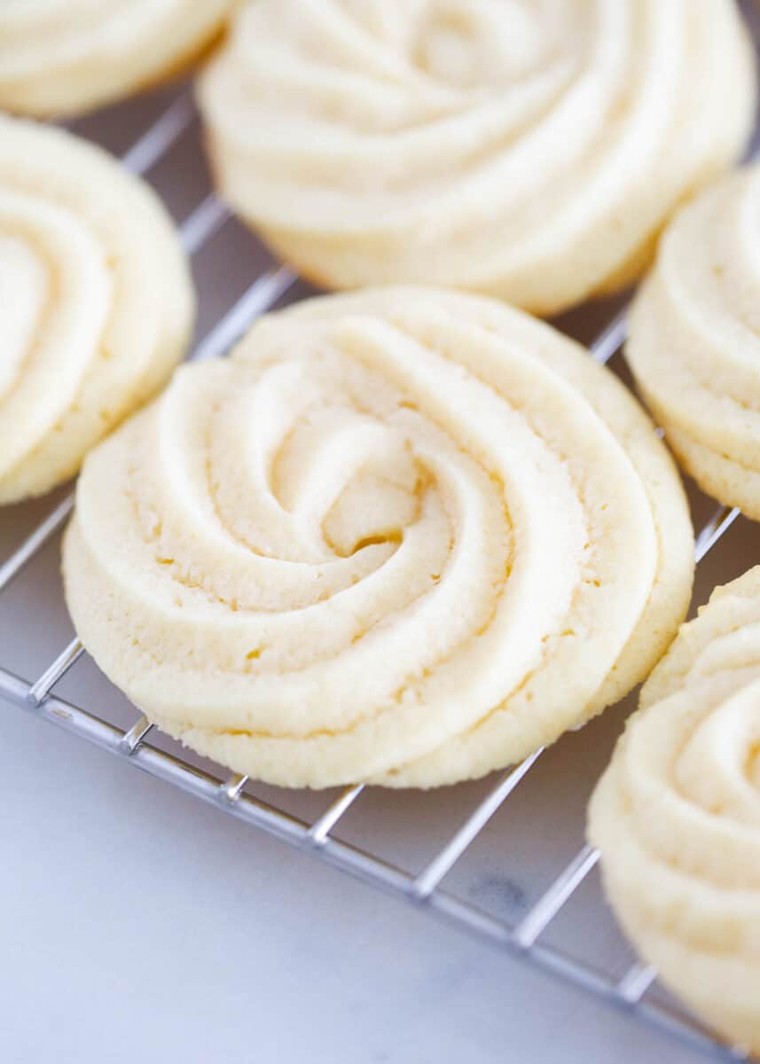 Butter cookies on a cooling rack.