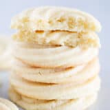 Stacked butter cookies on the counter.