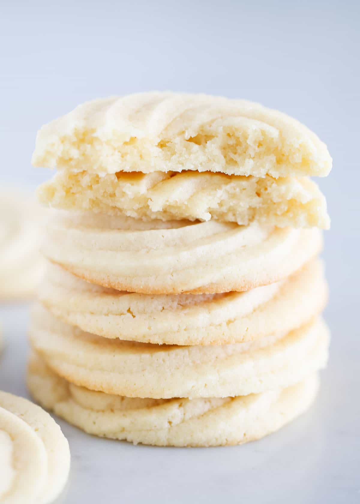 Stacked butter cookies on the counter.