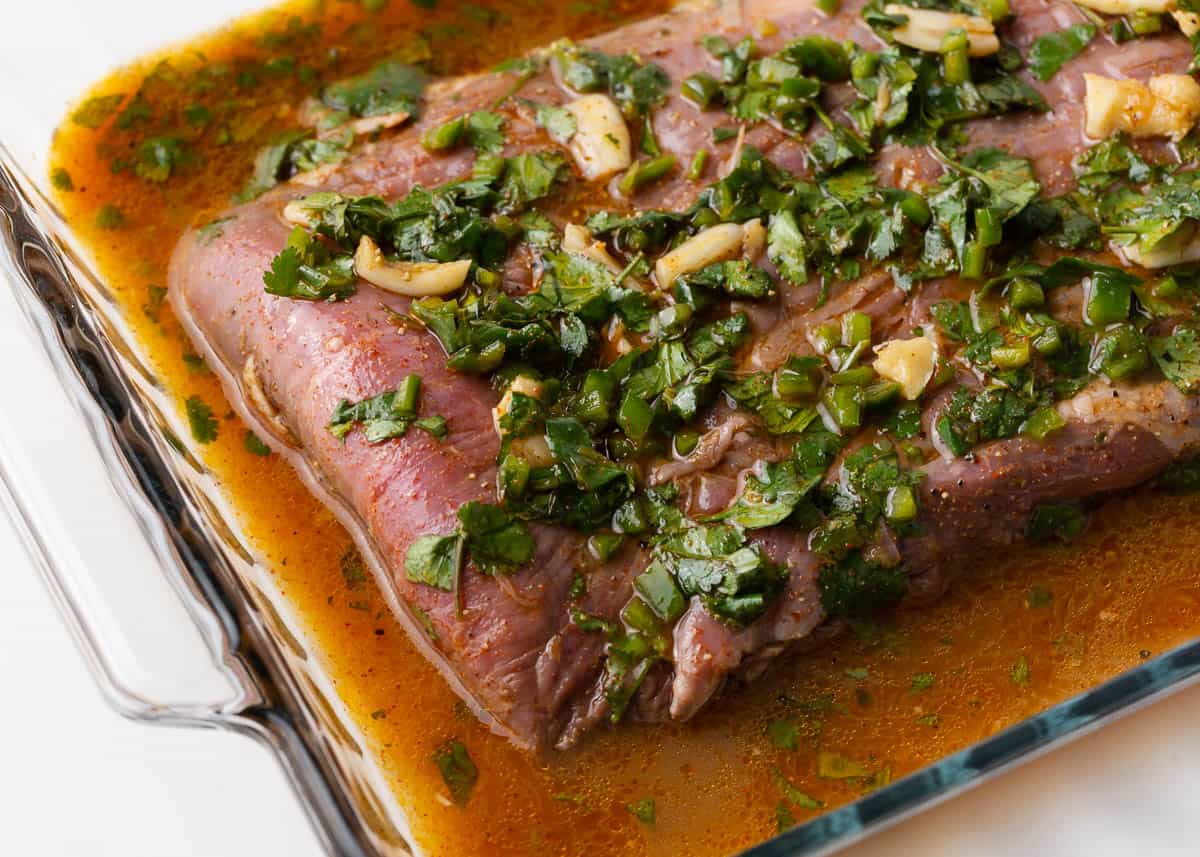 Carne asada marinade in glass dish.