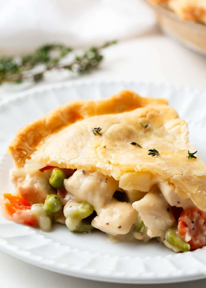 Slice of chicken pot pie on a white plate.