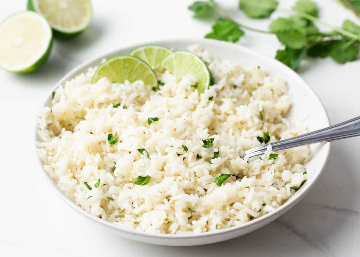 Cilantro lime rice in a white bowl.