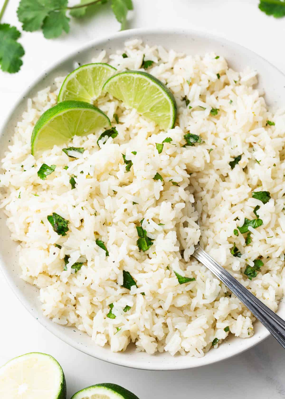 Cilantro lime rice in a white bowl.