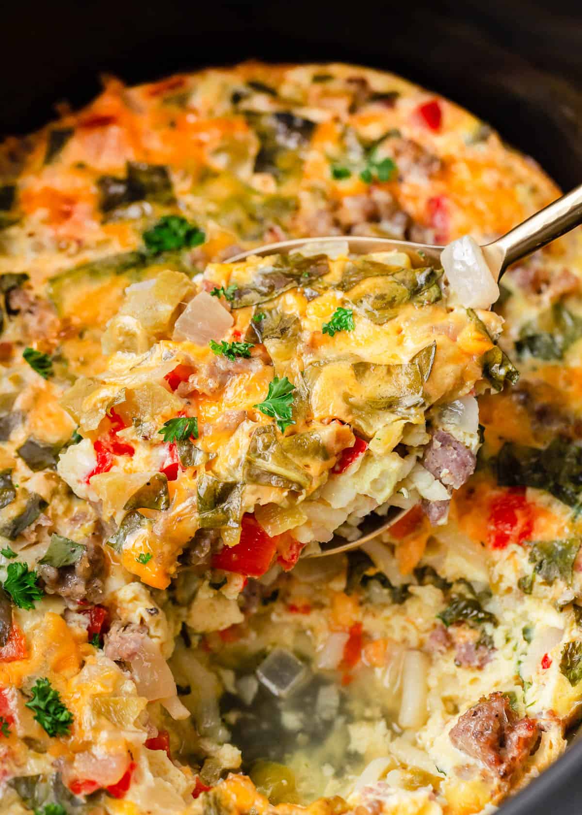 Close up of crockpot breakfast casserole being served.