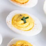 Deviled eggs on a white plate.