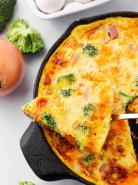 Ham and cheese frittata in a cast iron skillet for Easter brunch.