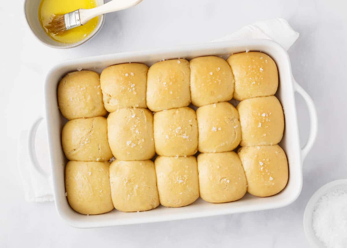 Hawaiian rolls on counter in white baking dish.