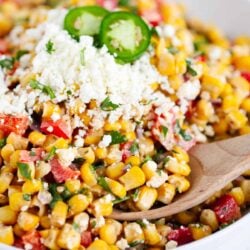 Mexican corn salad in a white bowl.