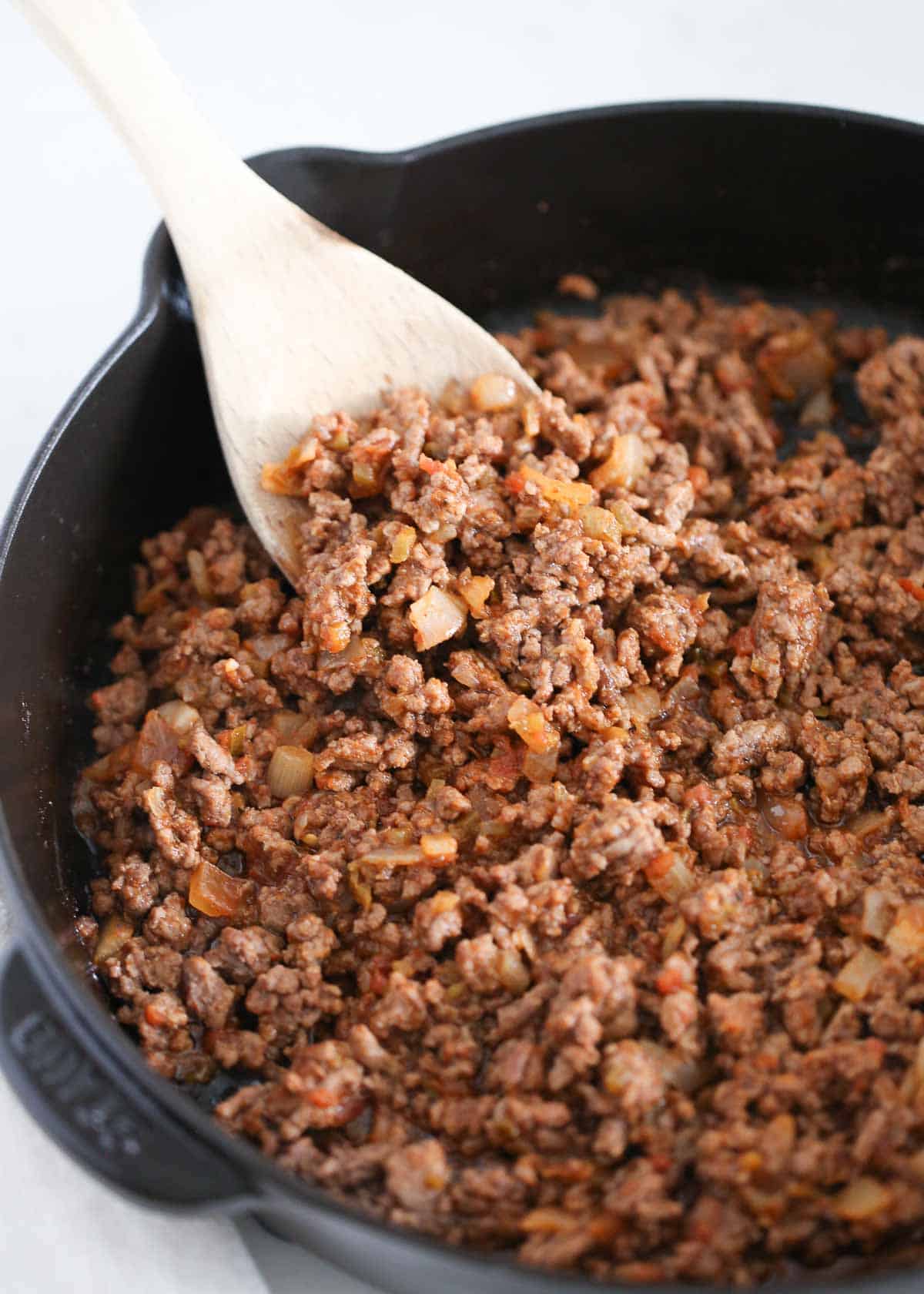 Taco meat in a cast iron skillet.