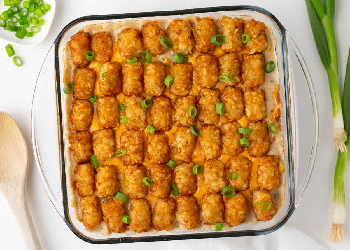 Tater tot casserole in a glass dish.