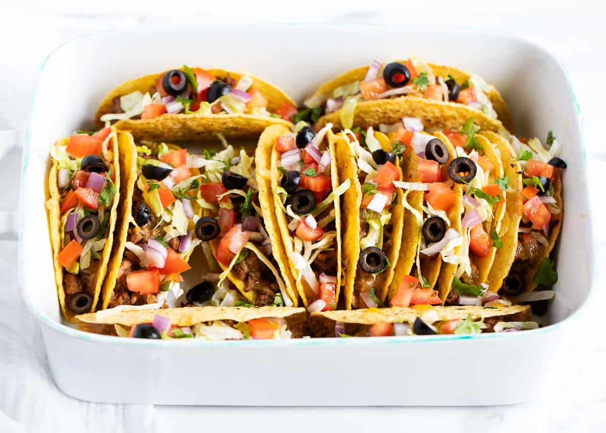 Ground beef tacos cooked in a white baking dish.